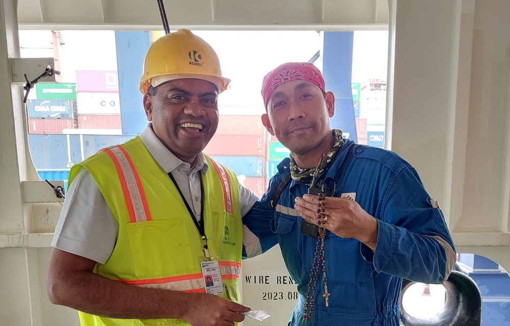 Father Valan and a Filipino Seafarer, Container Terminals, HK