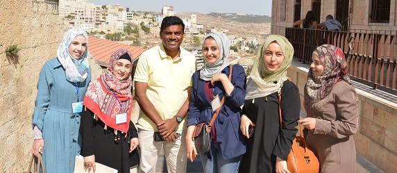 Schoolgirls with Father Valan, Bethlehem, Palestine, 2016